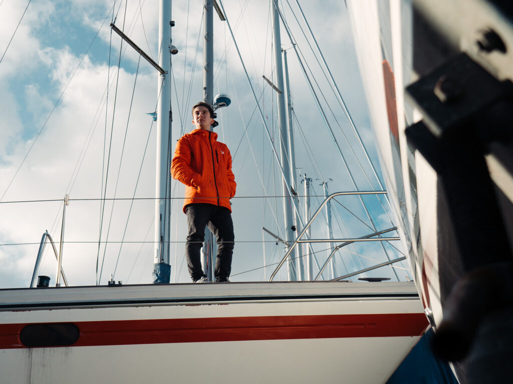sailor standing on a sailing boat
